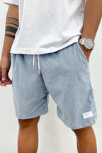 Relaxed shorts on model, three-quarter view