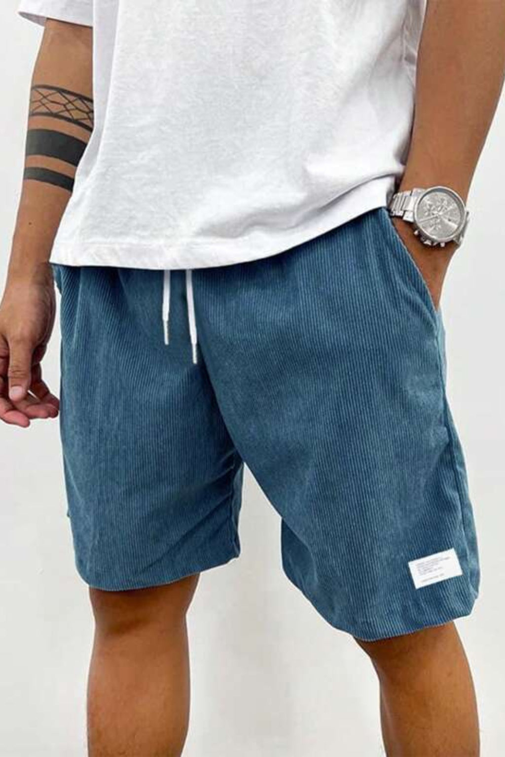 Waistband elastication and drawstring adjustment detail