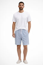 Model adjusting drawstring on waistband
