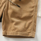 Close-up of corduroy texture and drawstring waistband