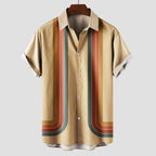 Model wearing navy and orange striped shirt, standing pose