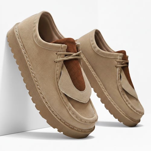 Men's suede slip-on loafers in neutral tone, front three-quarter view
