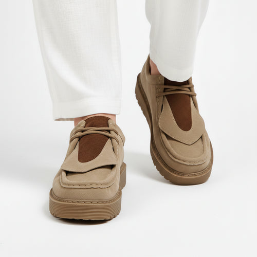 Suede loafer worn on foot, side profile showing fit and silhouette