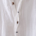 Flat lay of folded crinkle linen shirt showing full garment
