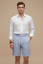 Model wearing striped chino shorts, standing pose