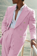 Close-up of double breasted blazer with six button closure and peak lapels