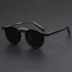 Three-quarter angle of round tortoise sunglasses against neutral background