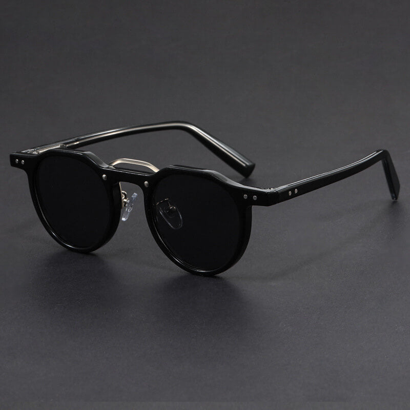 Three-quarter angle of round tortoise sunglasses against neutral background