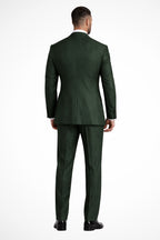 Model wearing green linen suit, standing pose full length