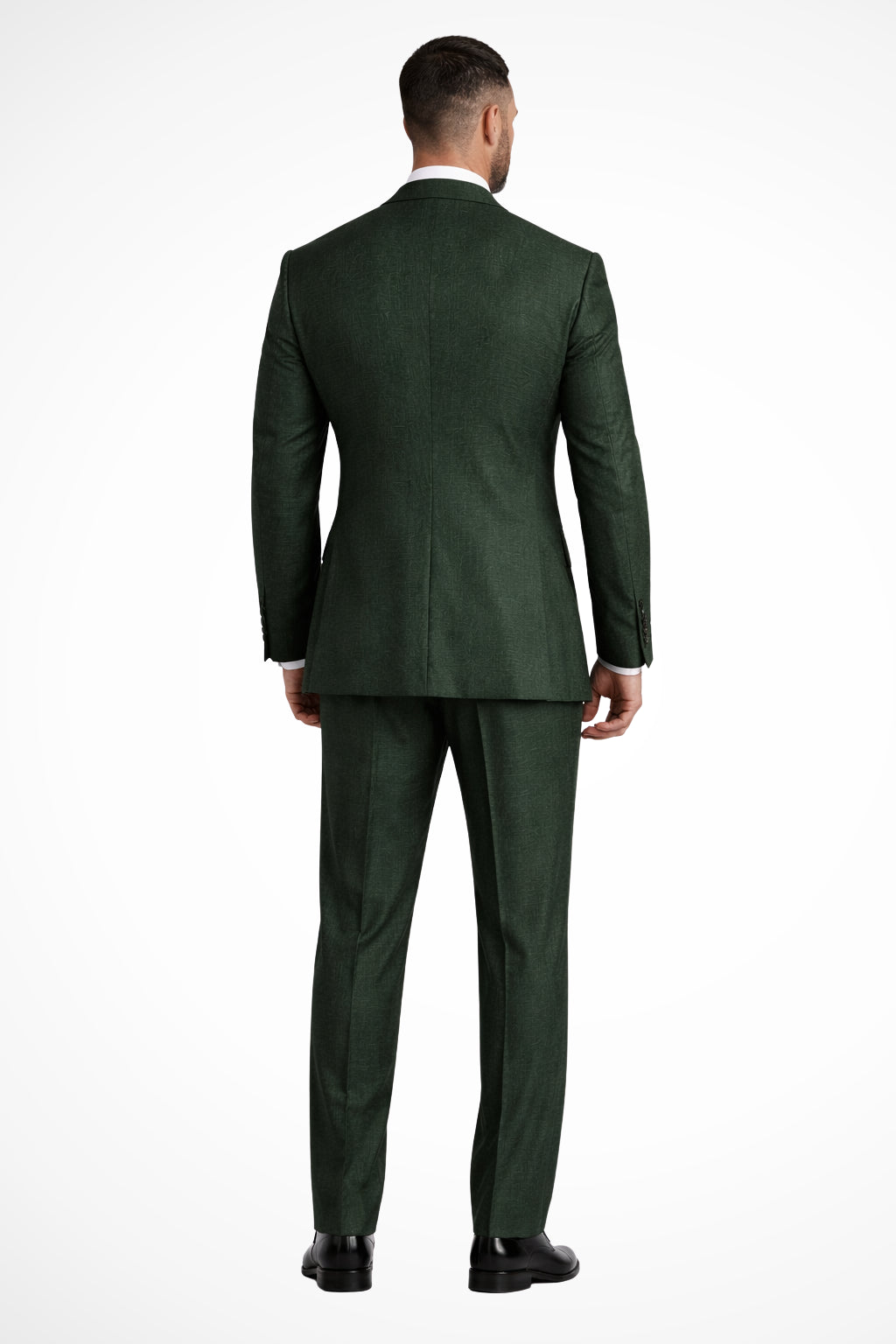 Model wearing green linen suit, standing pose full length