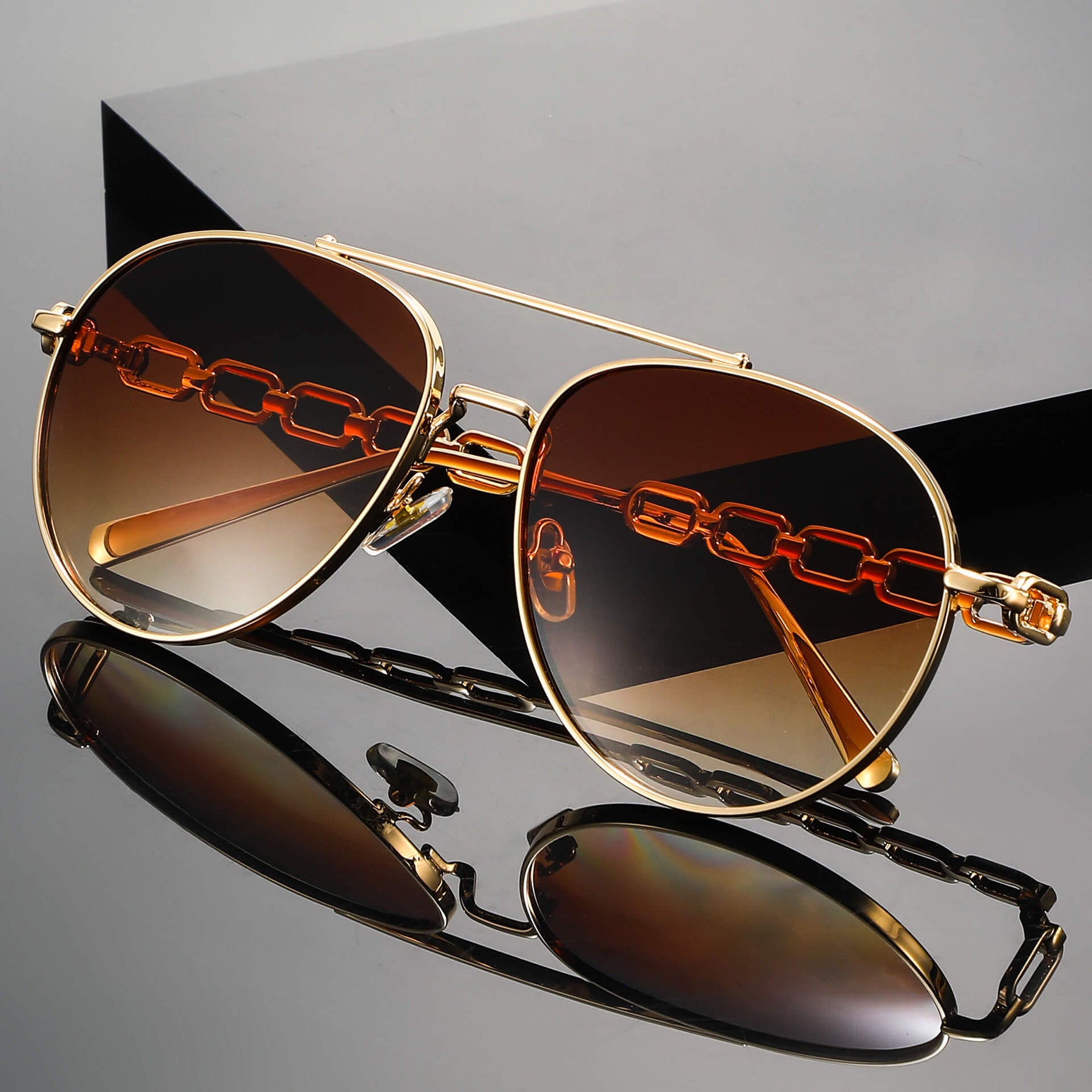 Flat lay of chain link aviator sunglasses showing full frame design