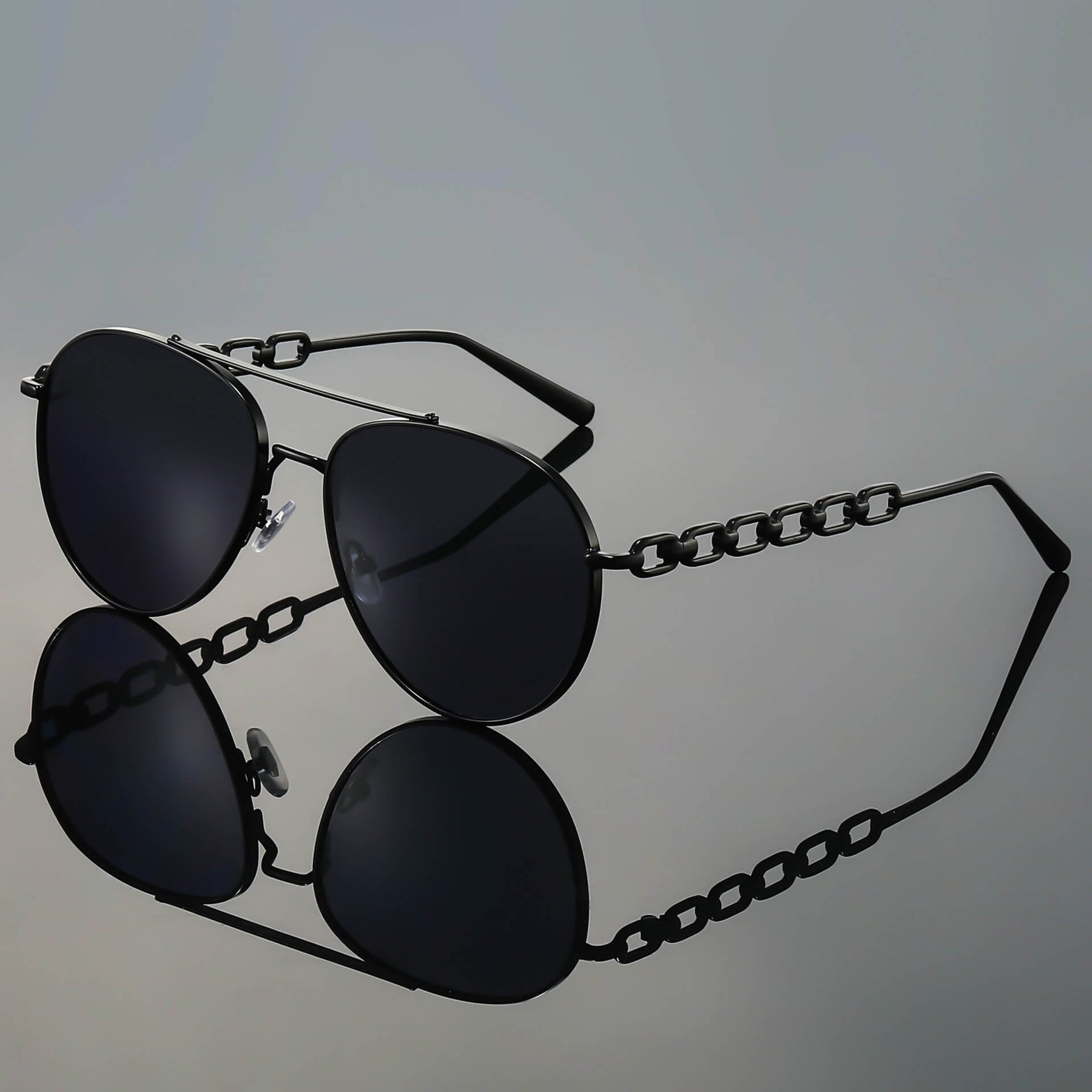 Detail shot of gradient brown lens and polished gold-tone frame