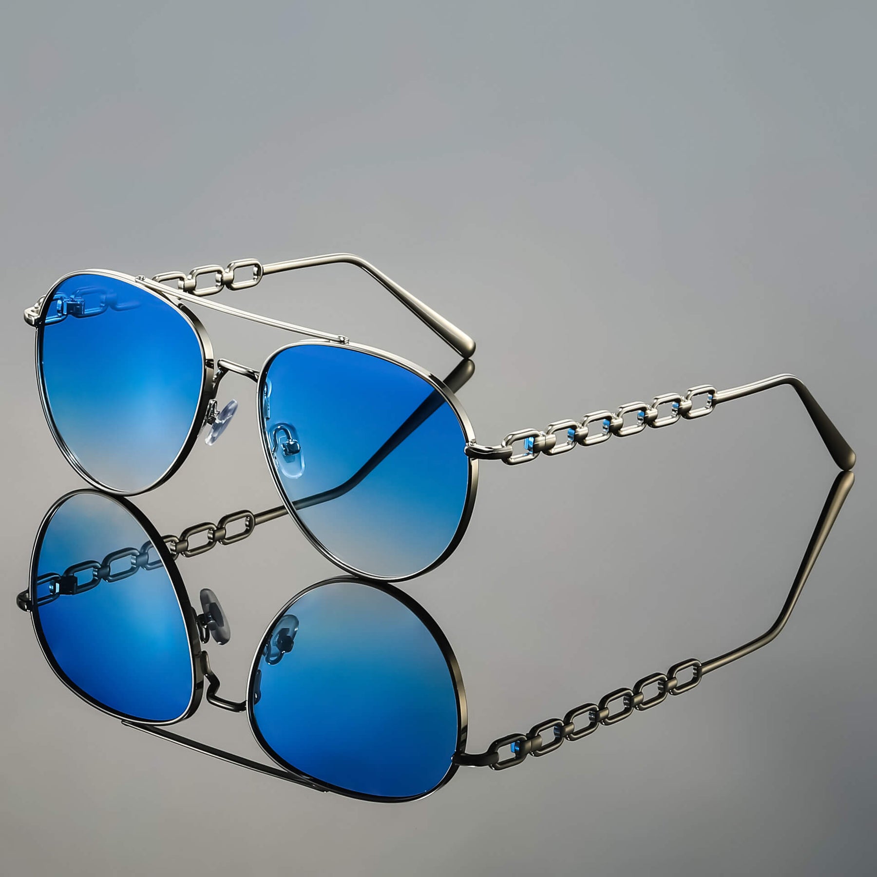 Model wearing chain link aviator sunglasses, side profile pose