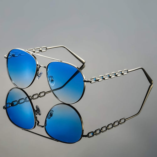 Model wearing chain link aviator sunglasses, side profile pose