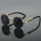 Men's round frame sunglasses with gold-toned metal frames and dark lenses, front view