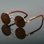 Side profile of round sunglasses showcasing ornate jaguar temple detailing