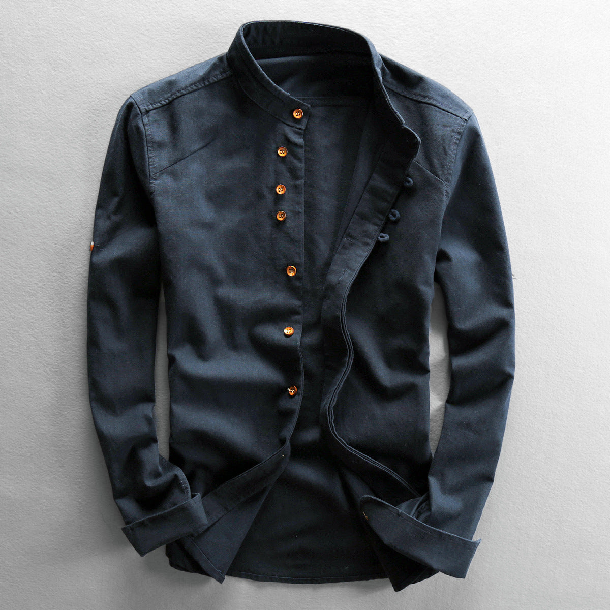 Model wearing linen mandarin collar shirt, standing pose
