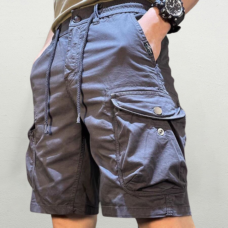 Men's relaxed fit cargo shorts, front view on neutral background
