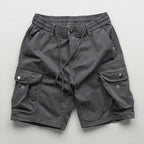 Model wearing cargo shorts, standing pose showing fit and length
