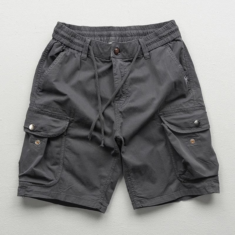 Model wearing cargo shorts, standing pose showing fit and length