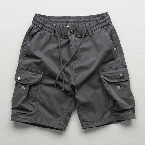Model wearing cargo shorts, standing pose showing fit and length