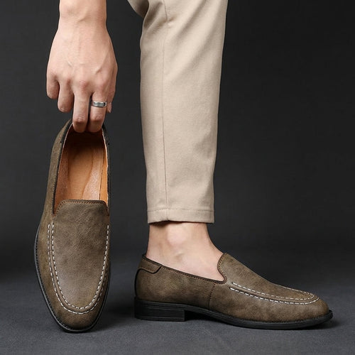 Man wearing leather loafers with casual chinos, standing pose