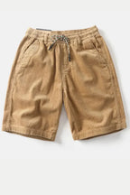 Model wearing corduroy shorts, standing pose