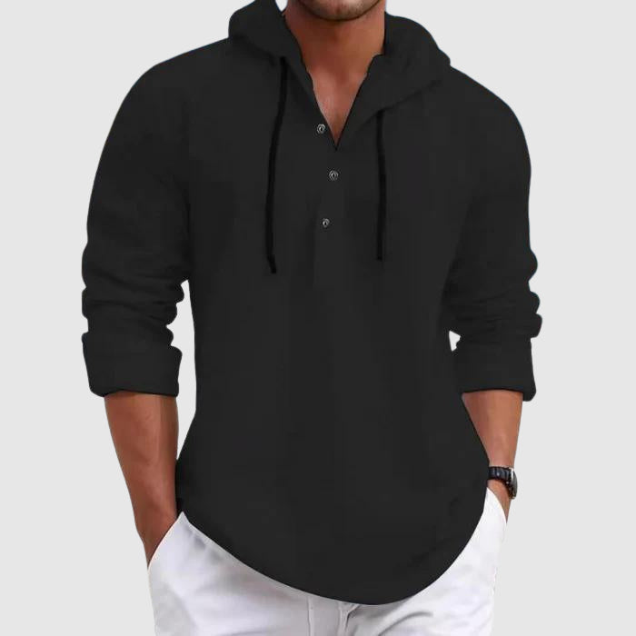 Model wearing hooded shirt, side profile pose