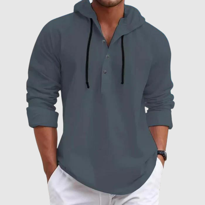 Model wearing hooded shirt with hood up, back view