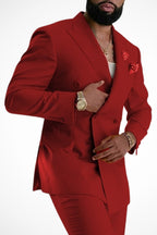 Double breasted suit jacket worn open, seated pose