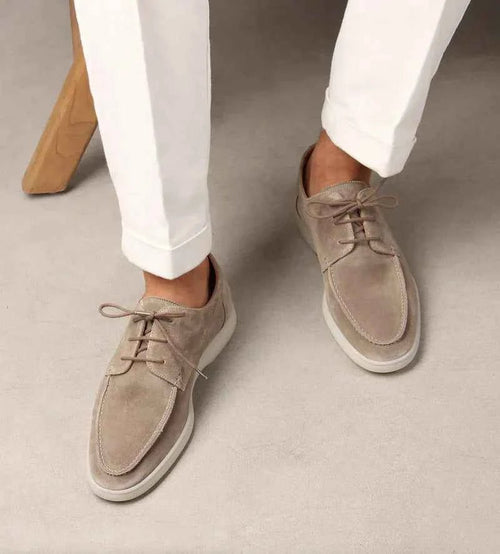 Man wearing navy suede loafers with smart casual outfit, standing pose