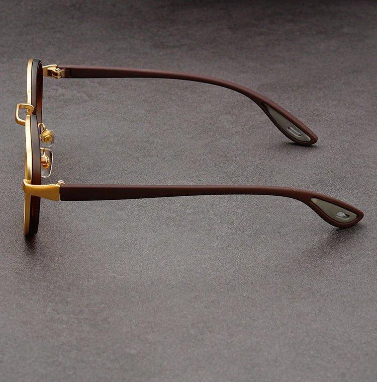 Model wearing sunglasses, angled view from below