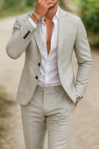 Model in full-length pose wearing linen jacket and trousers