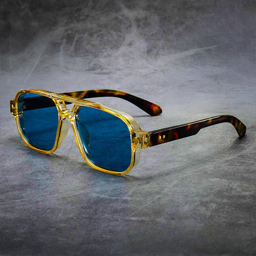 Oversized square sunglasses with yellow acetate front and tortoiseshell temples, displayed front-on