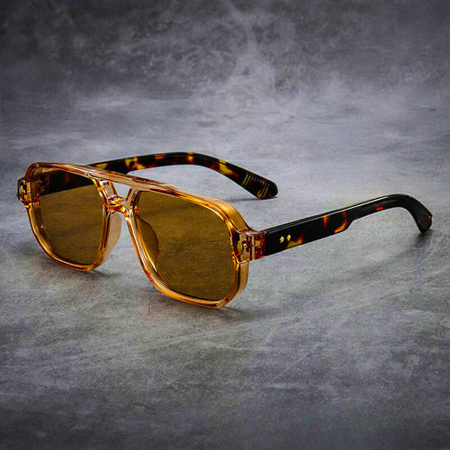 Model wearing tortoise square sunglasses, side profile view