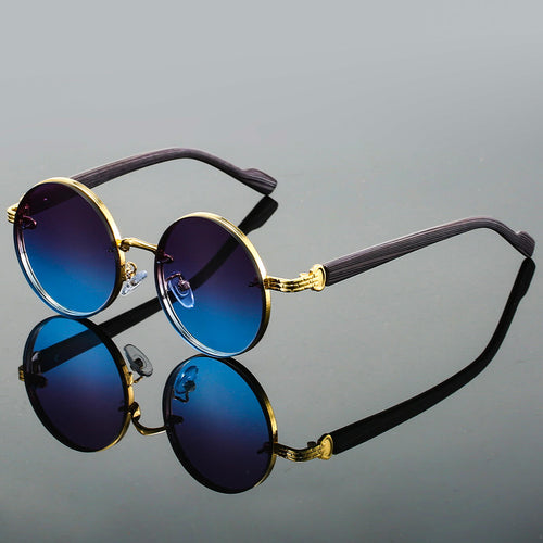 Model wearing gradient round sunglasses, side profile pose