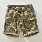 Side angle of camo shorts displaying relaxed fit and rolled cuffs