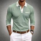 Close-up of white contrast trim on polo collar and chest pocket detail