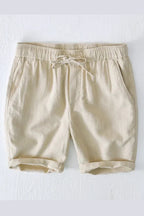 Model wearing linen shorts, rear view showing fit