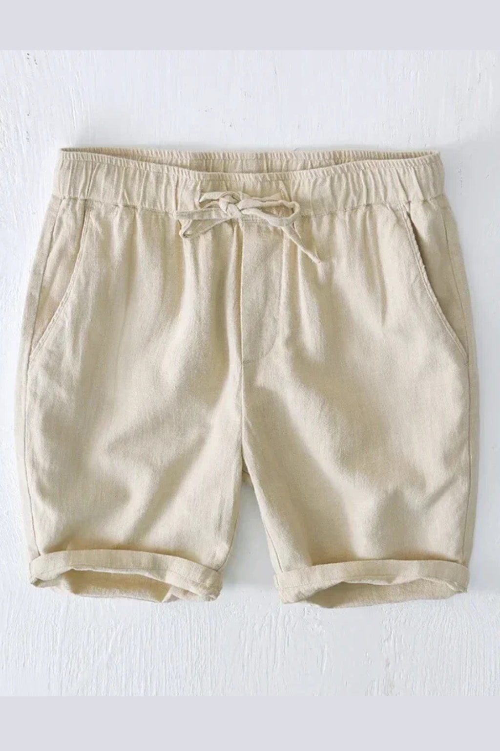 Model wearing linen shorts, rear view showing fit