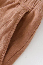 Close-up of elasticated waist and drawstring fastening