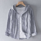 Model wearing shirt layered over casual tee