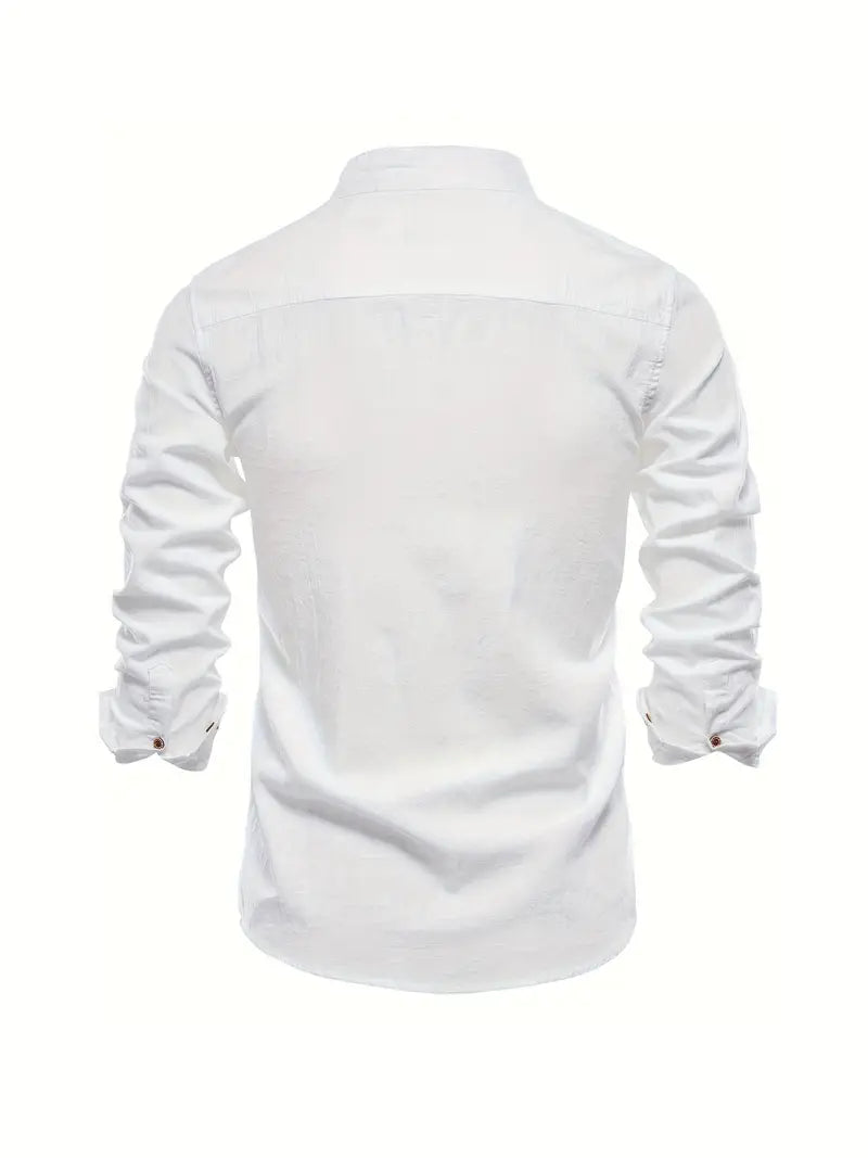 Model wearing white embroidered logo shirt, standing pose
