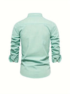 Side profile of model wearing long sleeve embroidered shirt