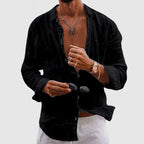 Model wearing open-neck linen shirt in casual styling