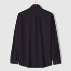Back view of white shirt with black collar detail