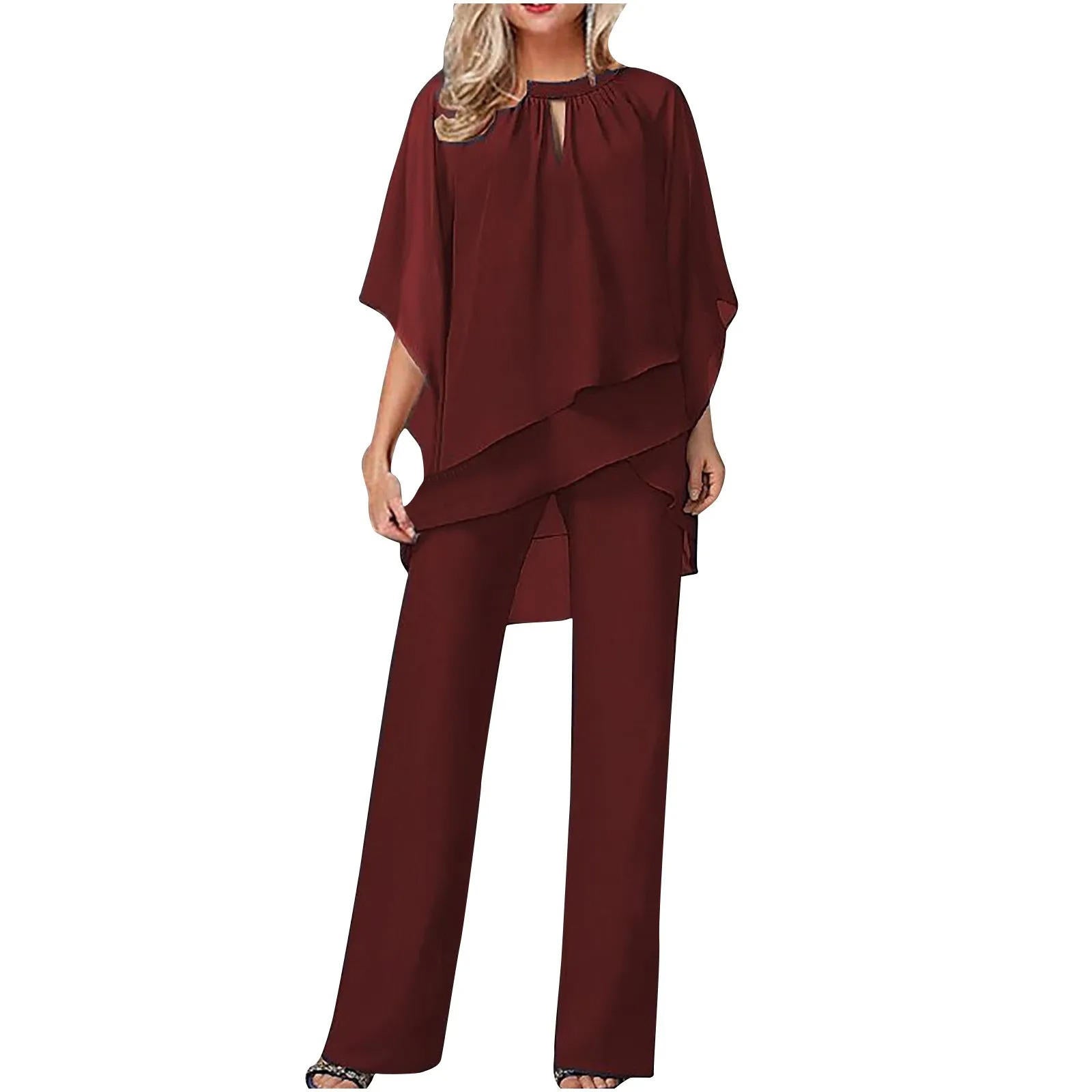 Model wearing chiffon jumpsuit, side profile pose showing overlay drape