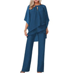 Model in jumpsuit standing pose, showing full silhouette and movement