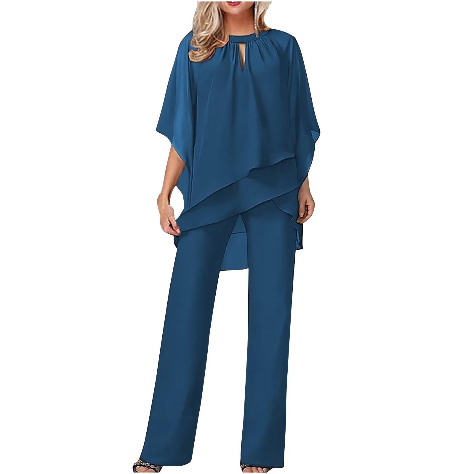 Model in jumpsuit standing pose, showing full silhouette and movement