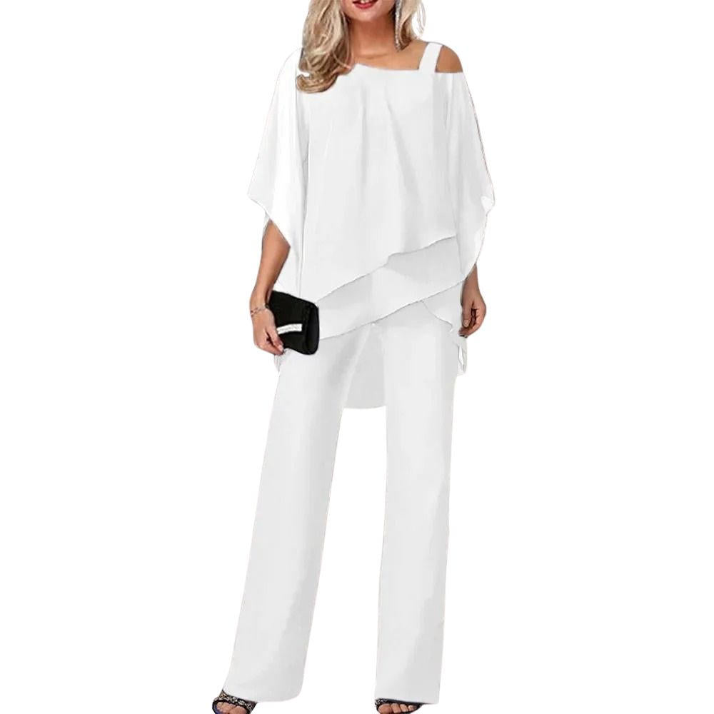 Back view of jumpsuit highlighting asymmetric layered overlay